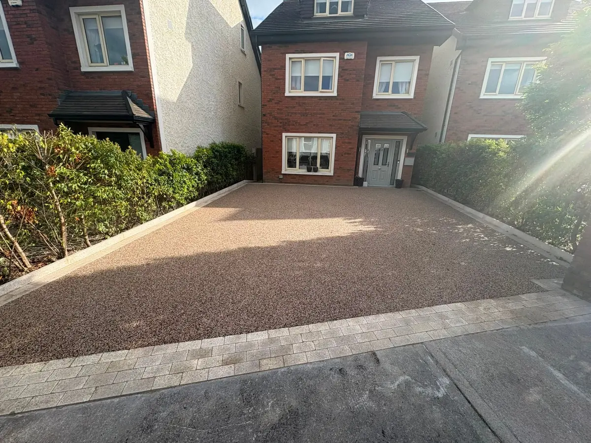 Warm resin-bound driveway with granite sett edging in North Dublin
