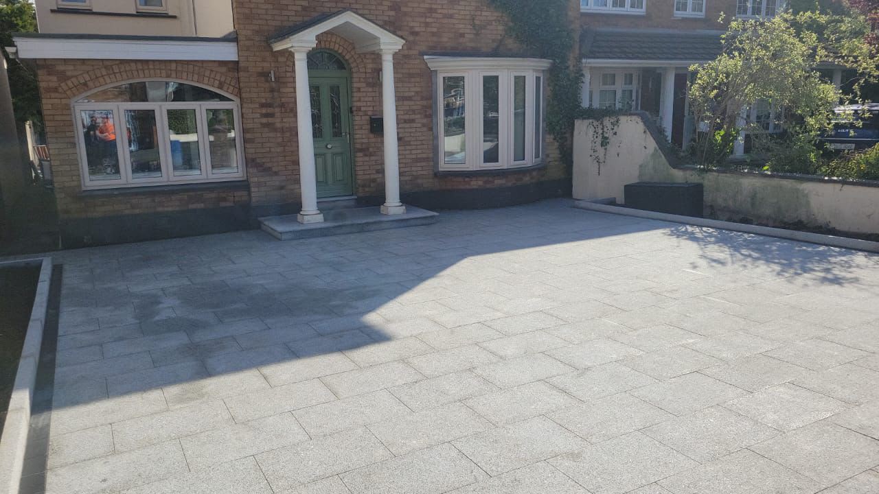 Wide silver granite paved driveway at a Dublin home